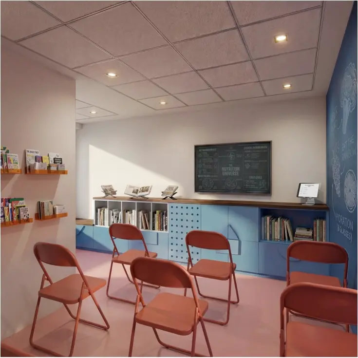 An interior with bespoke blue casework, a display shelf and red chairs.